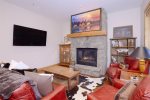 Main-level living room- Gas fireplace- Open floor plan